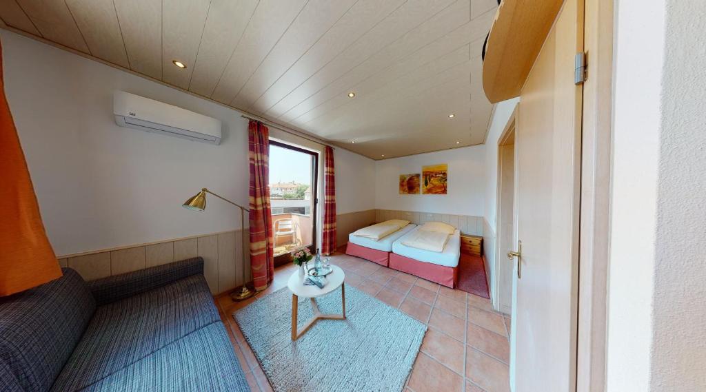 Postel nebo postele na pokoji v ubytování Hotel Rothenburger Hof