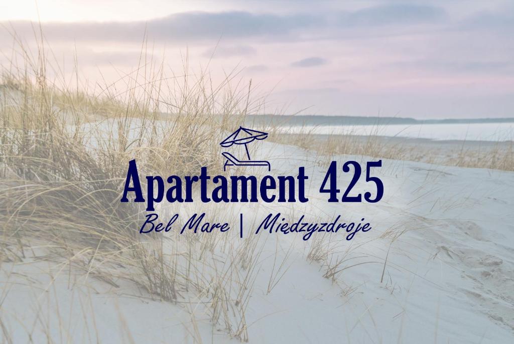 a sign for a beach with a kite in the sand at Apartament 425 - Bel Mare Międzyzdroje in Międzyzdroje