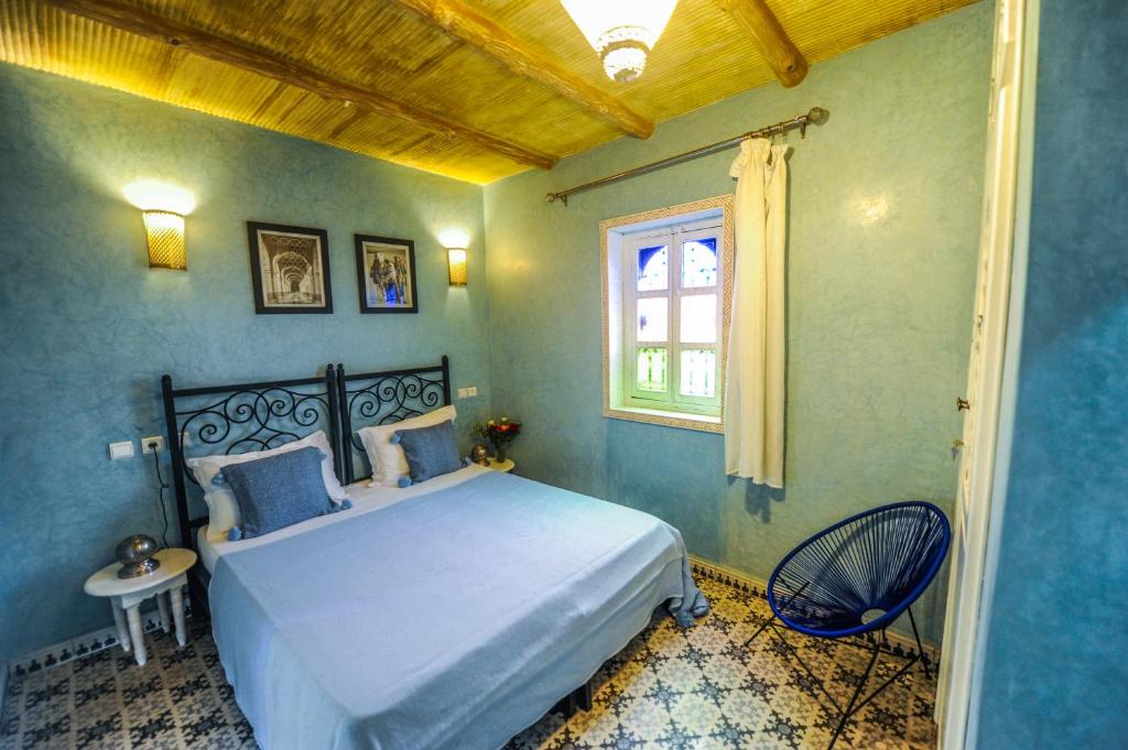 Postel nebo postele na pokoji v ubytování Riad Milouda