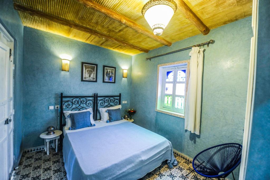 Postel nebo postele na pokoji v ubytování Riad Milouda