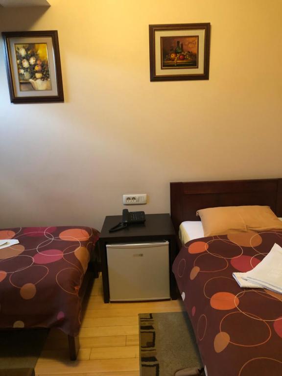 Postel nebo postele na pokoji v ubytování Hotel Royal