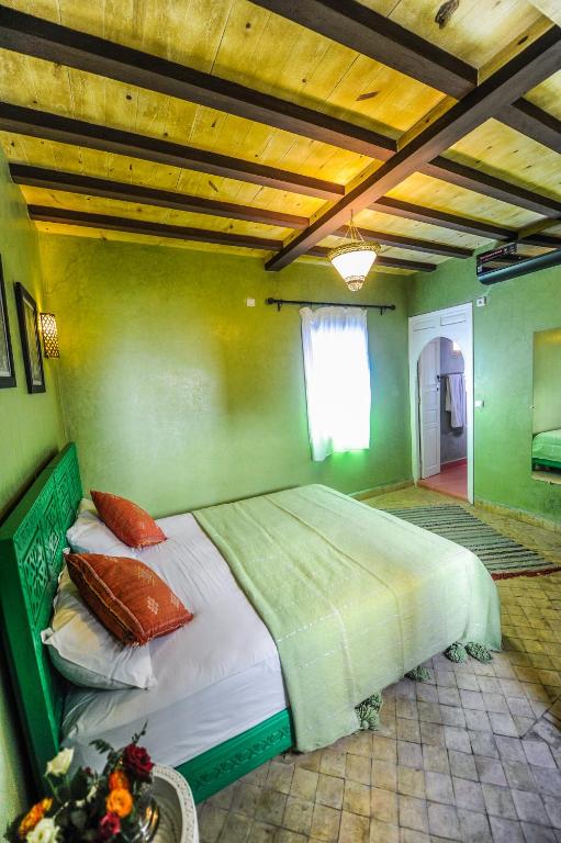 Postel nebo postele na pokoji v ubytování Riad Milouda