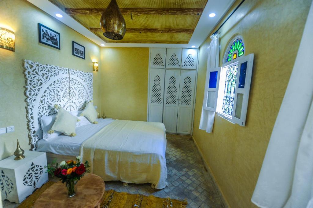 Postel nebo postele na pokoji v ubytování Riad Milouda