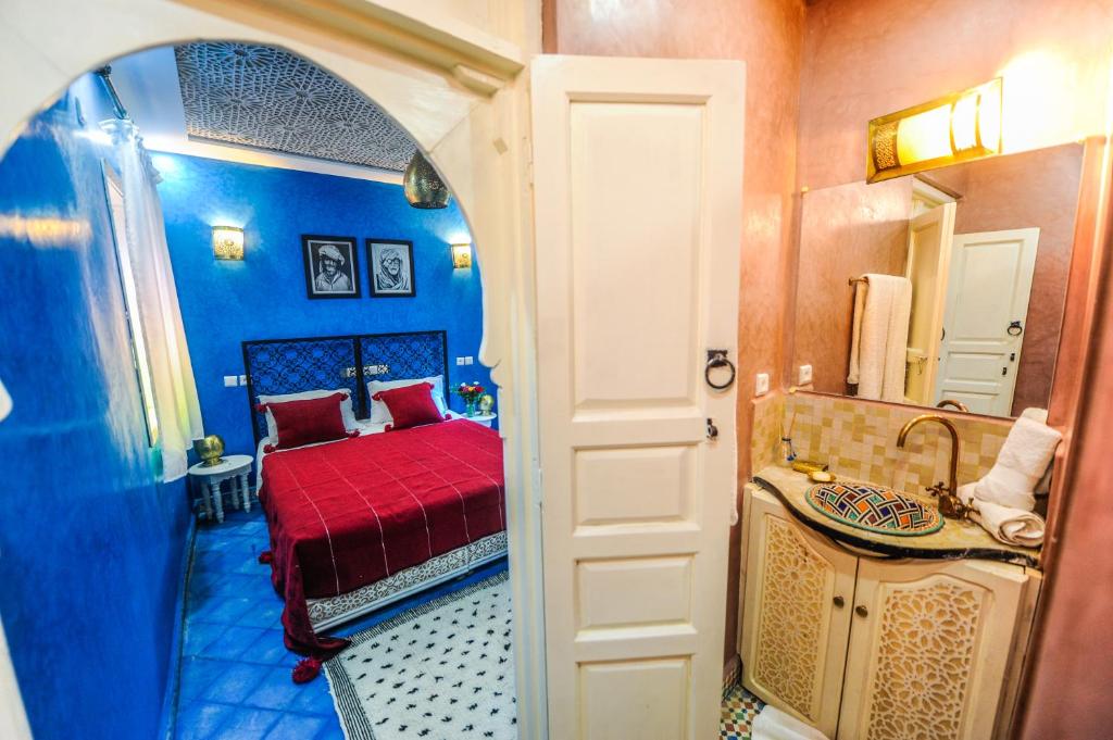Postel nebo postele na pokoji v ubytování Riad Milouda