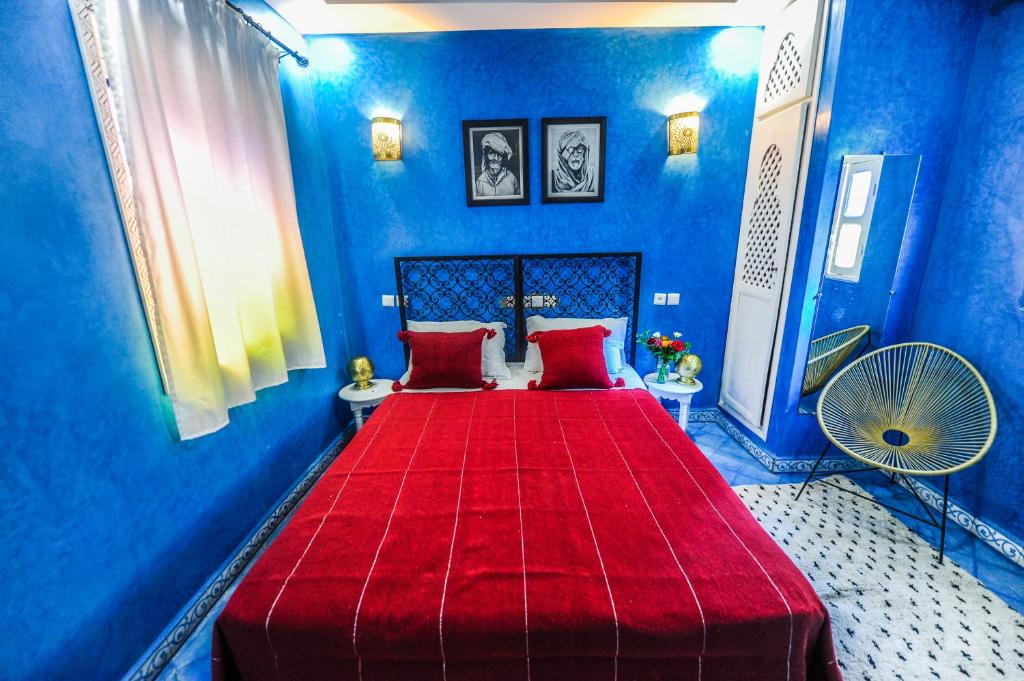 Postel nebo postele na pokoji v ubytování Riad Milouda