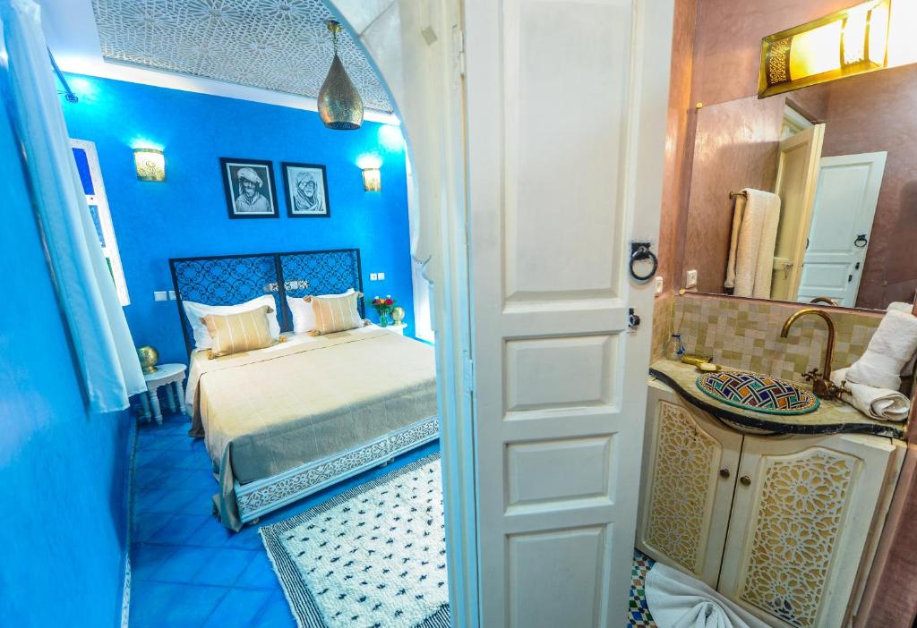 Postel nebo postele na pokoji v ubytování Riad Milouda