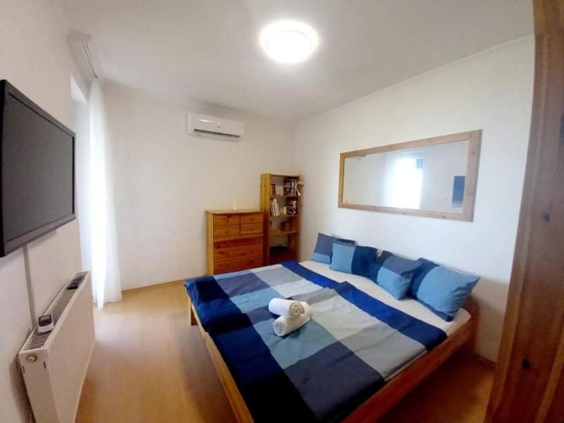 Posteľ alebo postele v izbe v ubytovaní Balaton BeachSide Apartman Siófok N1
