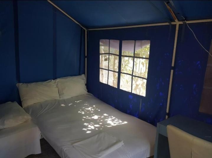 Postel nebo postele na pokoji v ubytování XeniCamp-Retreat