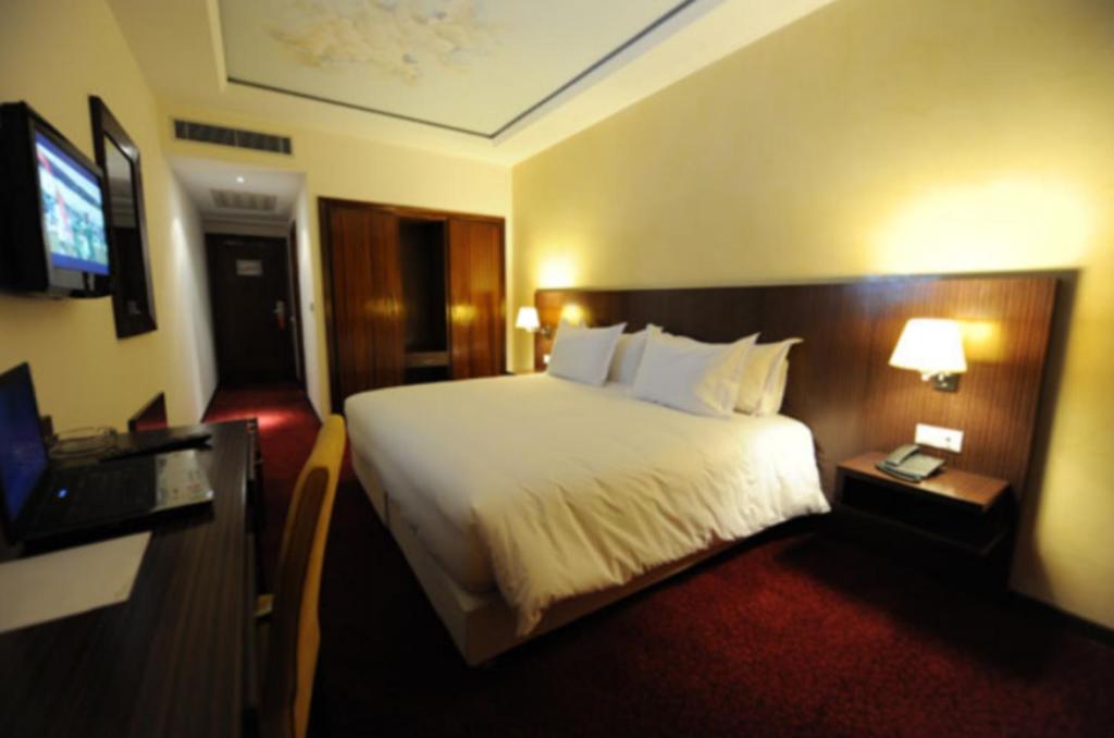 Postel nebo postele na pokoji v ubytování Rive Hotel