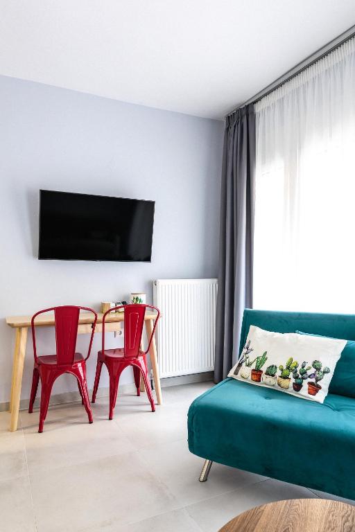 TV a/nebo společenská místnost v ubytování Art Central Suites