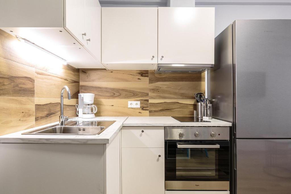 Kuchyň nebo kuchyňský kout v ubytování Art Central Suites