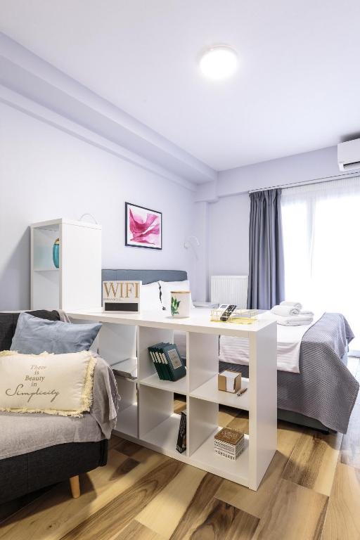 Postel nebo postele na pokoji v ubytování Art Central Suites