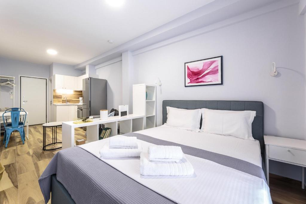 Postel nebo postele na pokoji v ubytování Art Central Suites