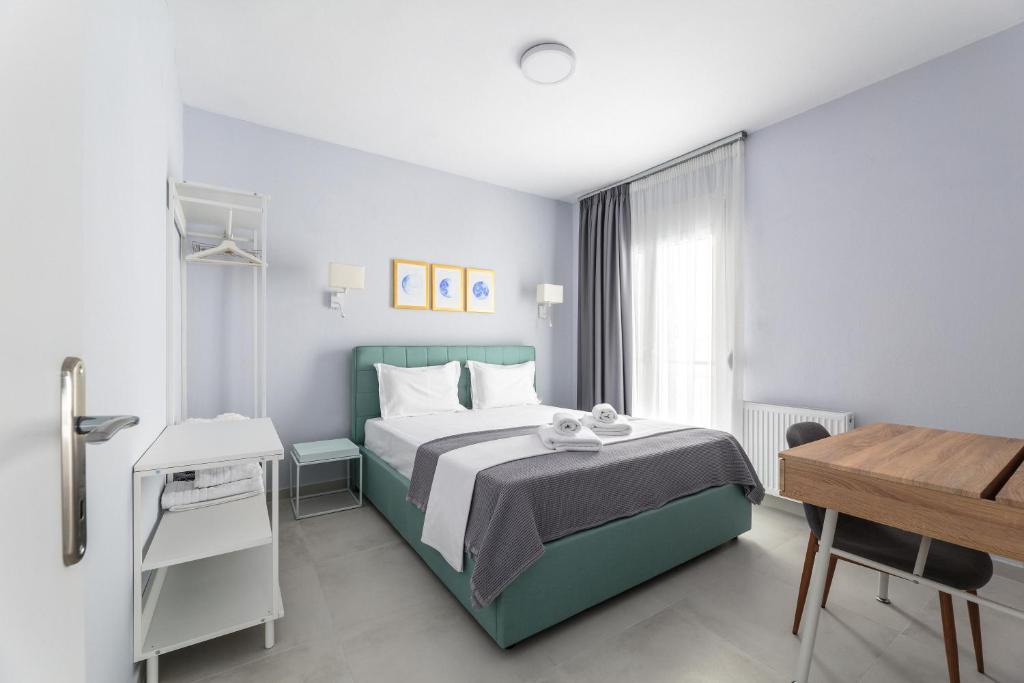 Postel nebo postele na pokoji v ubytování Art Central Suites