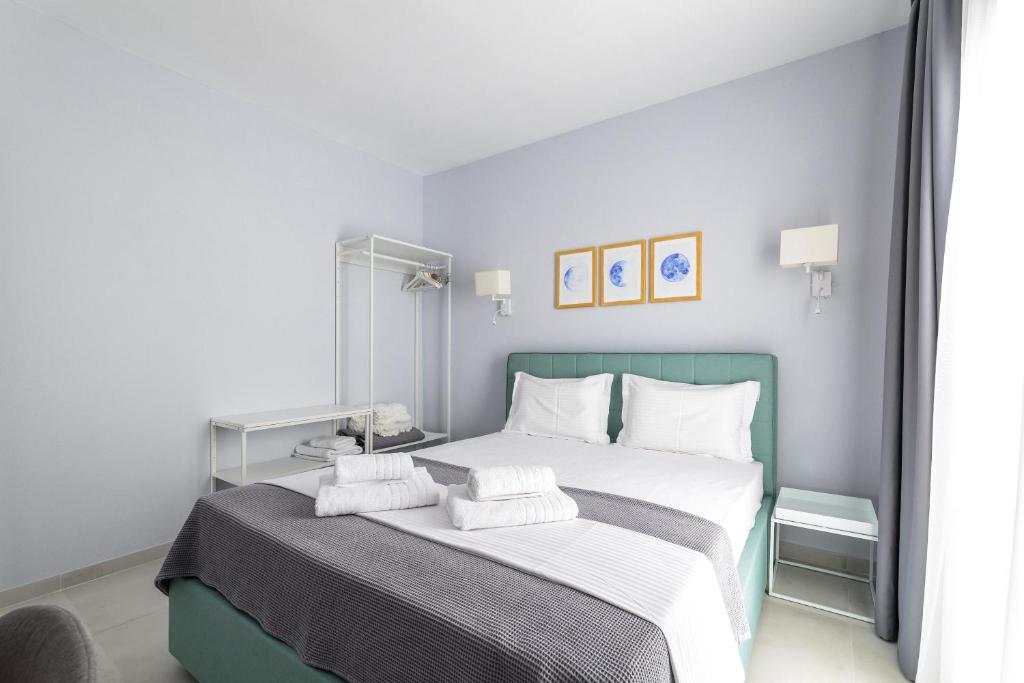 Postel nebo postele na pokoji v ubytování Art Central Suites