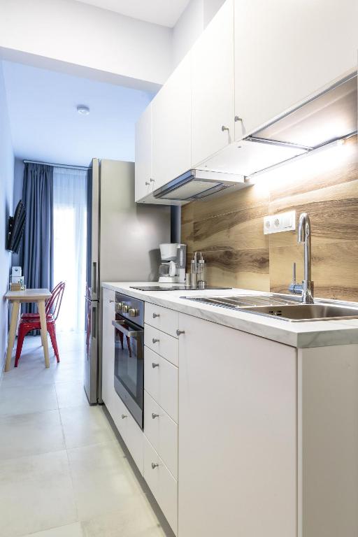Kuchyň nebo kuchyňský kout v ubytování Art Central Suites