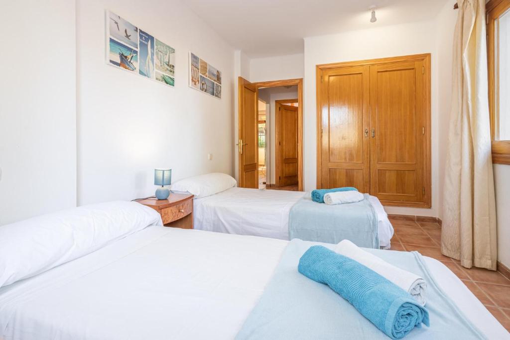 Postel nebo postele na pokoji v ubytování Santa Eulalia