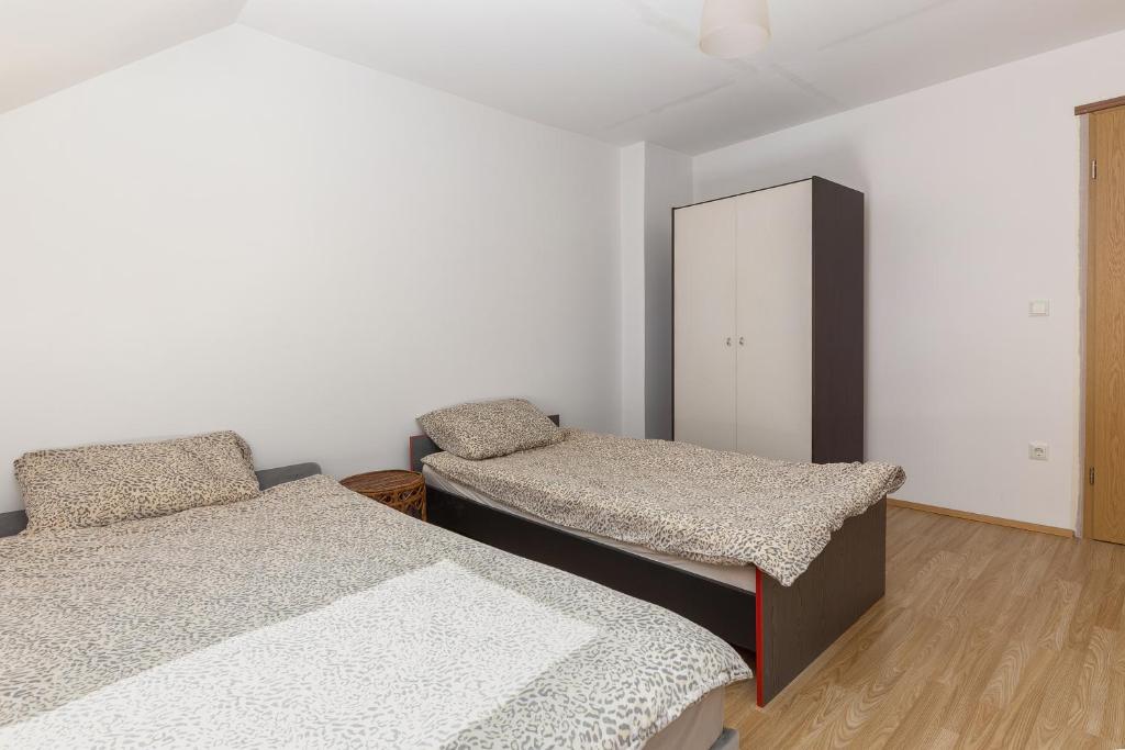 Postel nebo postele na pokoji v ubytování Apartmaji Trstenjak