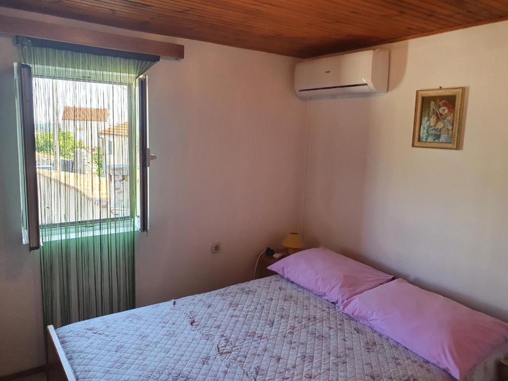 Postel nebo postele na pokoji v ubytování Apartman Letizia