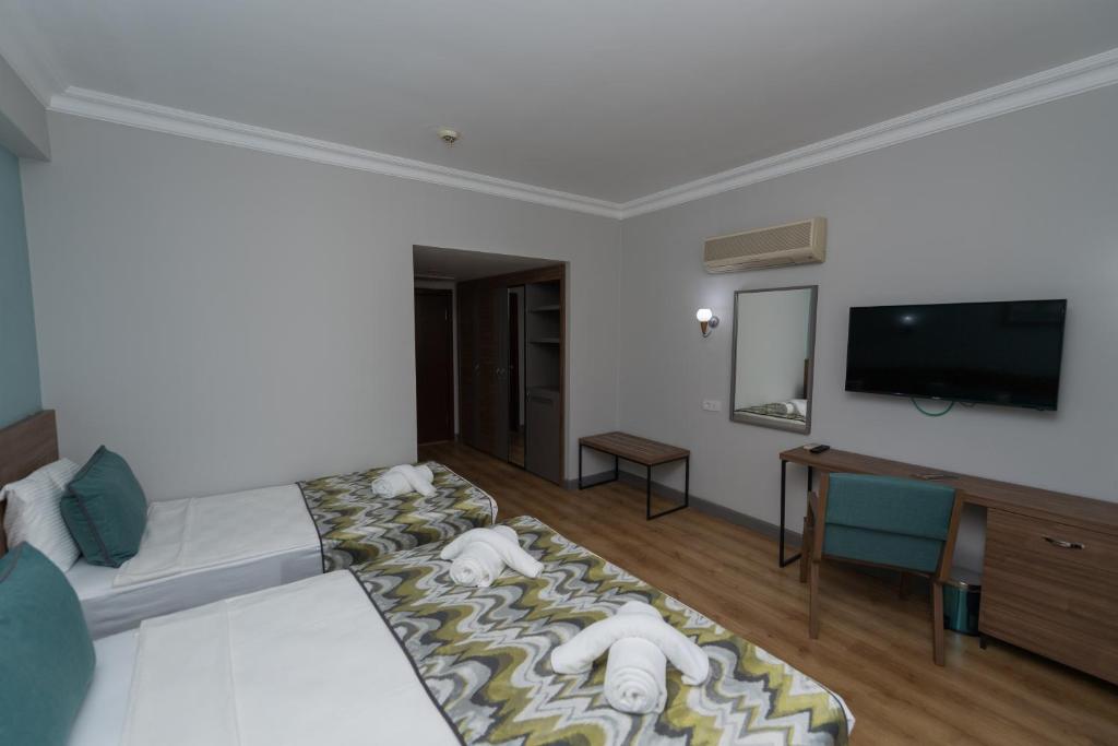 TV a/nebo společenská místnost v ubytování Side Village Family Suite - All Inclusive