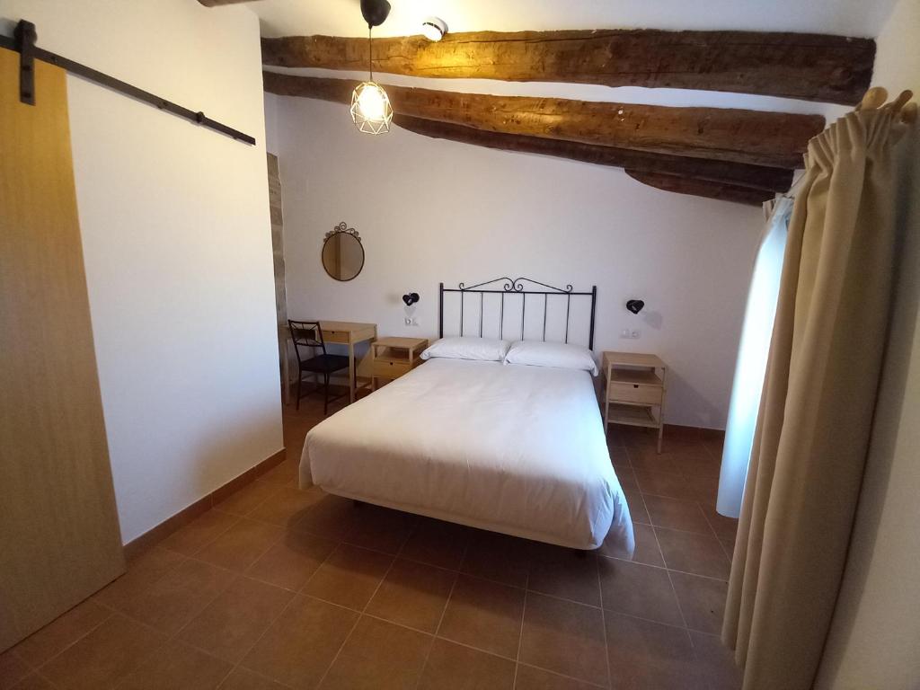 Postel nebo postele na pokoji v ubytování Rincón de Guara
