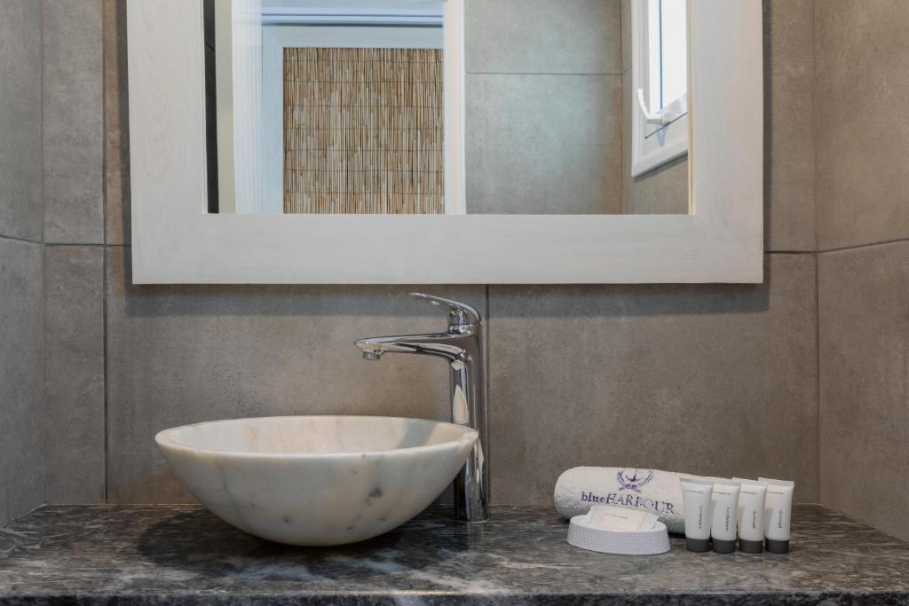 a bathroom sink with a large white bowl sink at Blue Harbour Boutique in Ayia Napa
