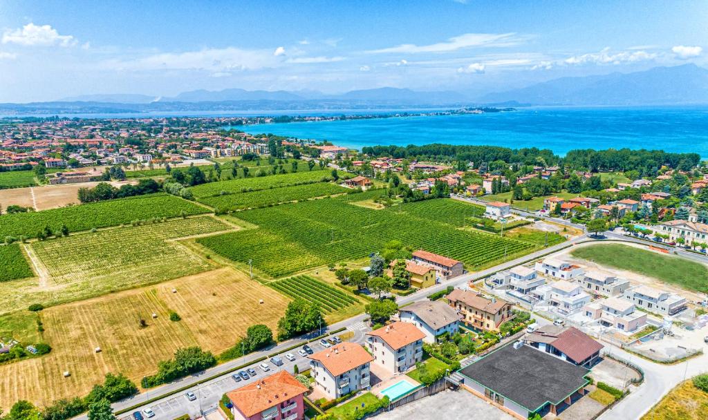 an aerial view of a city and the ocean at Wolf House - Sirmione Holiday in Sirmione