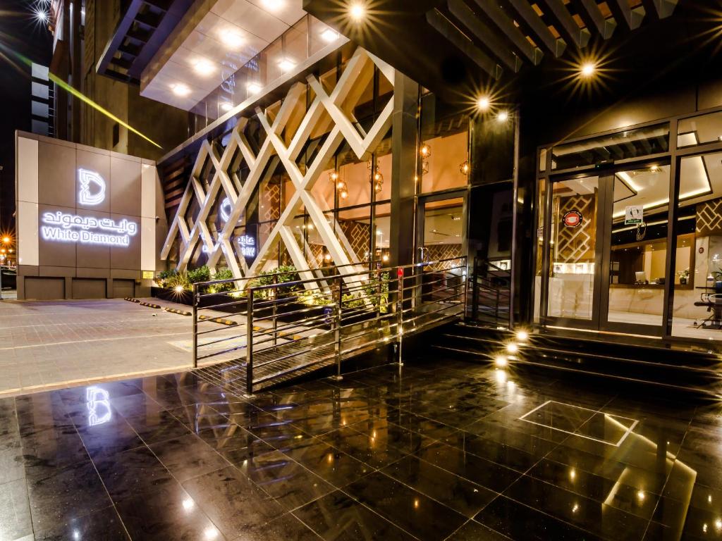 a lobby of a building at night with lights at White Diamond Hotel Sari in Jeddah