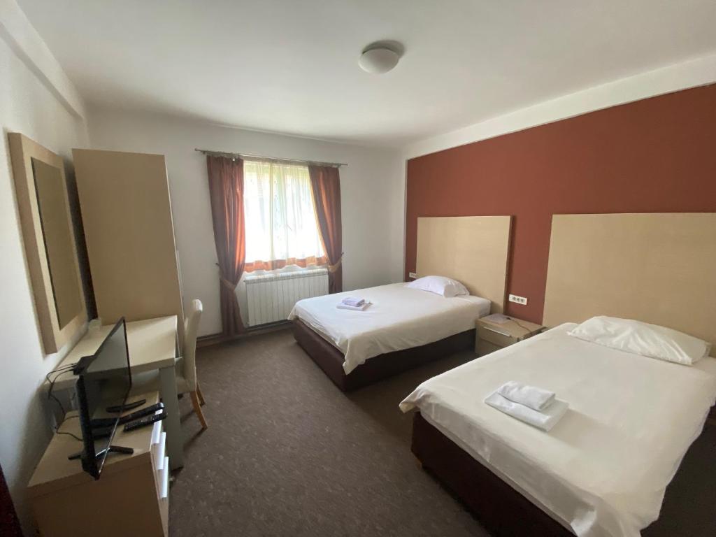 Postel nebo postele na pokoji v ubytování Hotel Dominus
