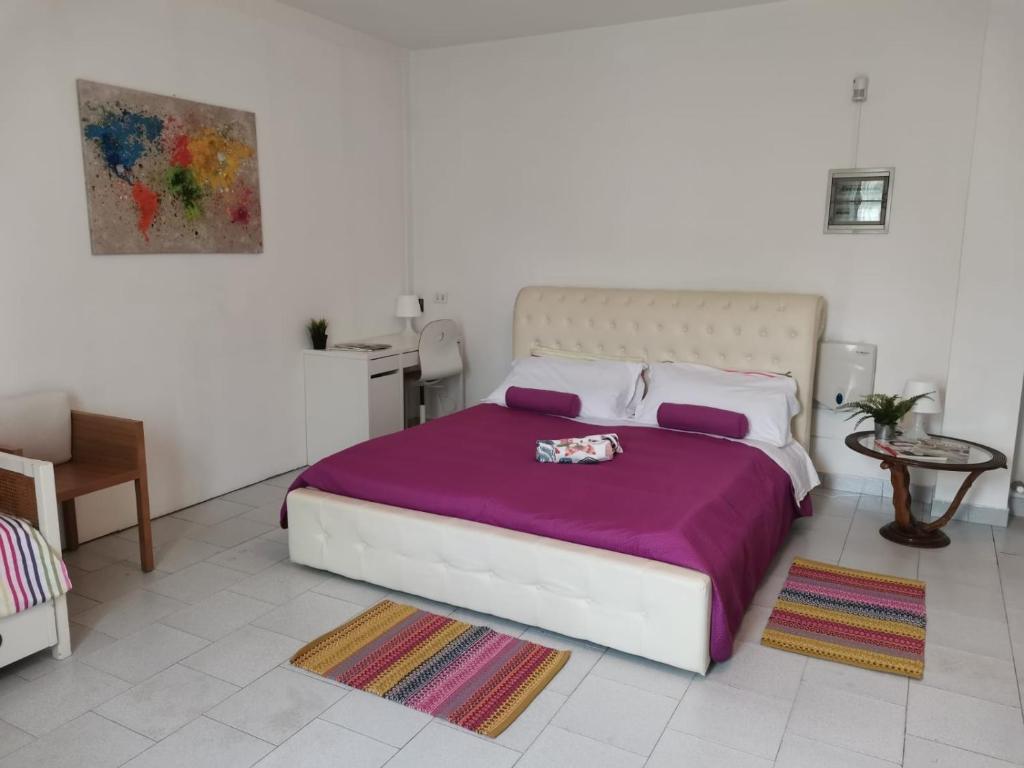 A bed or beds in a room at Bnbook Villa Biancospino