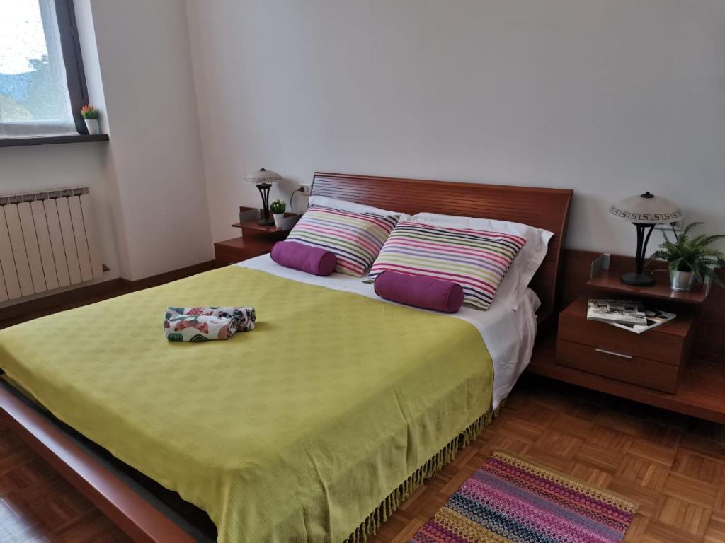 A bed or beds in a room at Bnbook Villa Biancospino