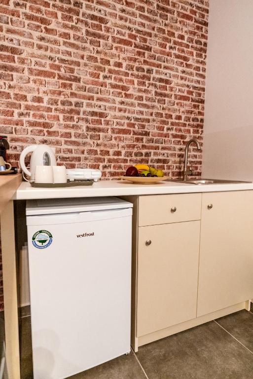 Kuchyň nebo kuchyňský kout v ubytování Unique Experience Apartment’s