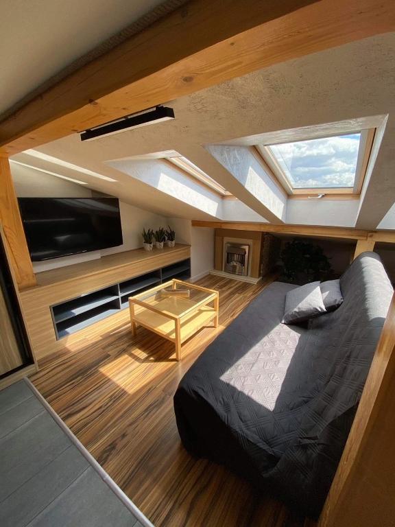 Posteľ alebo postele v izbe v ubytovaní Apartamenty pod Skosami