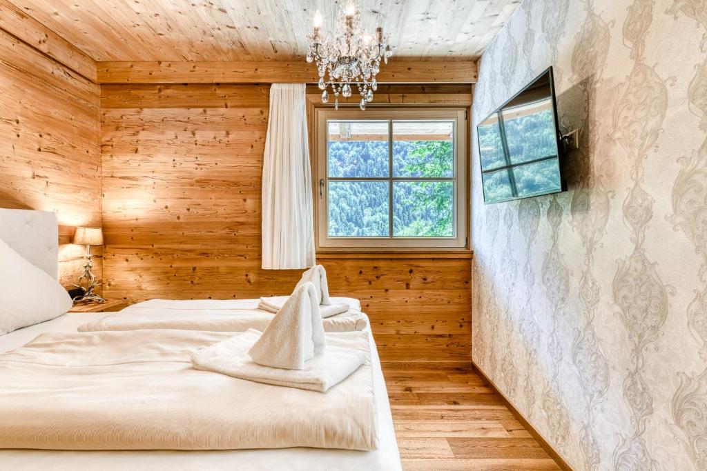 A bed or beds in a room at Dahoam-Apartments by A-Appartments