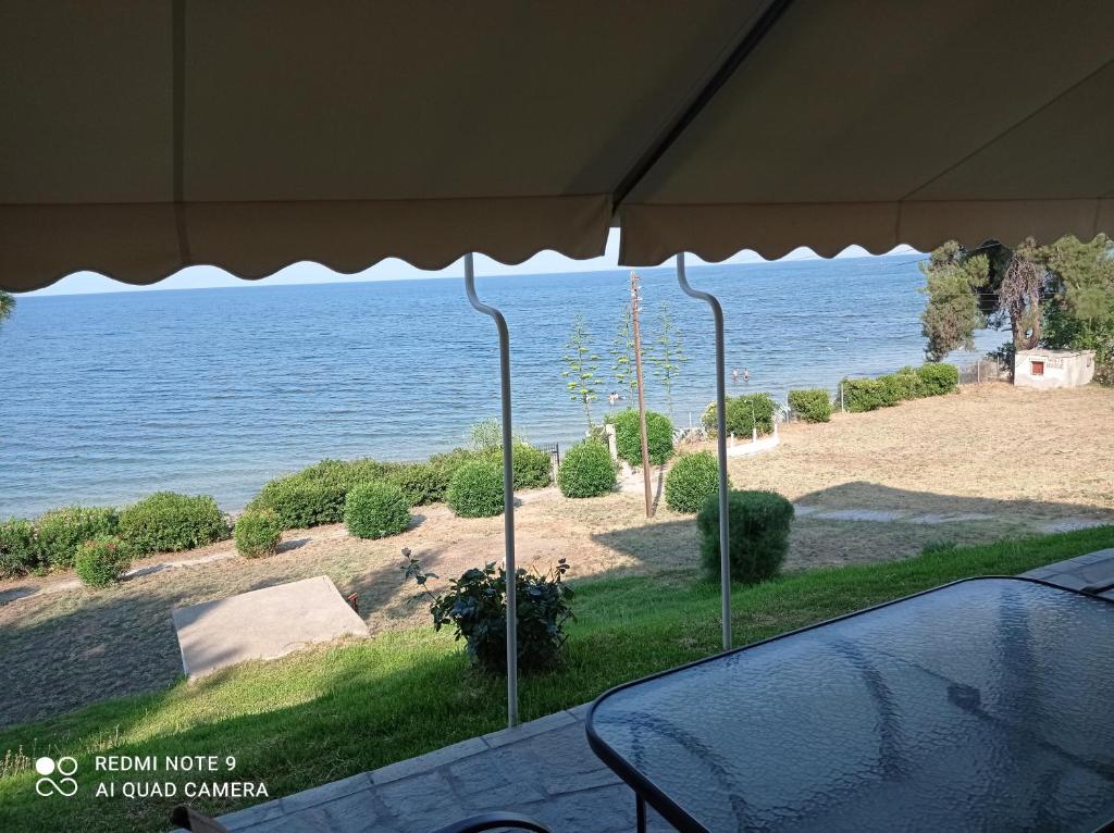 a view of the ocean from a house at Sunset Apartment in Epanomi