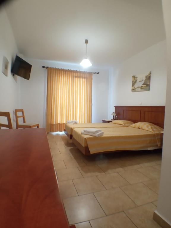Postel nebo postele na pokoji v ubytování Hotel Oceanis