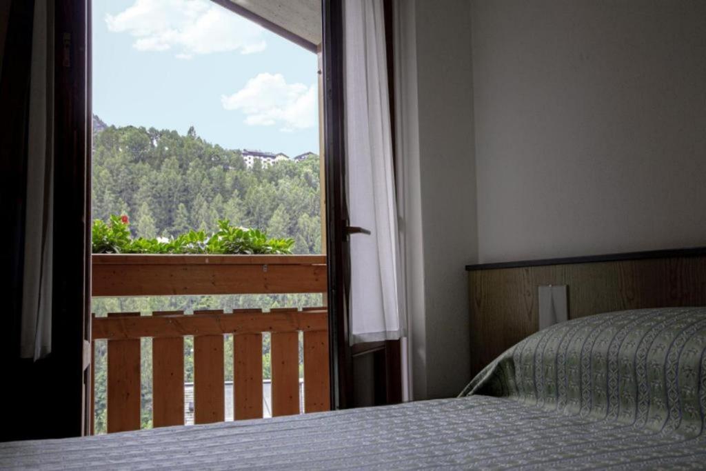 Postel nebo postele na pokoji v ubytování Hotel Moizi