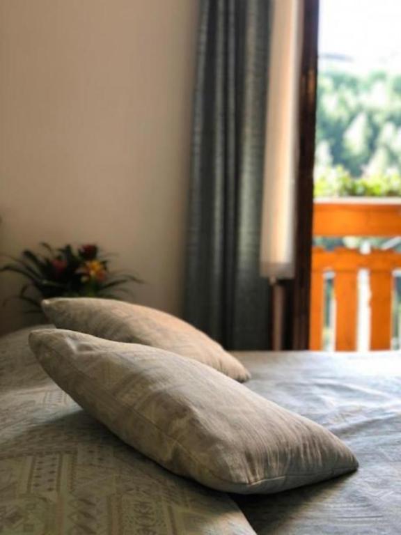 Postel nebo postele na pokoji v ubytování Hotel Moizi