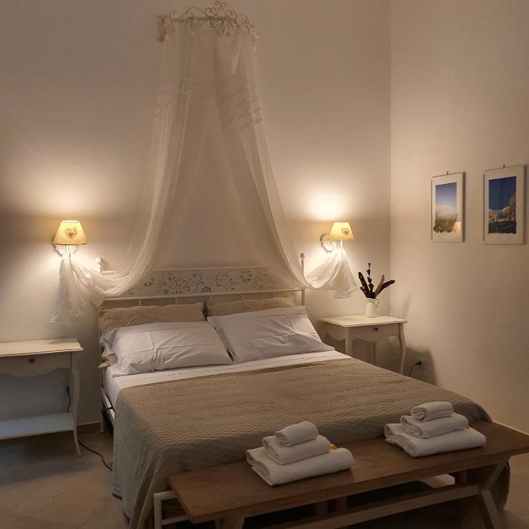 Posteľ alebo postele v izbe v ubytovaní Bianca Suite Polignano