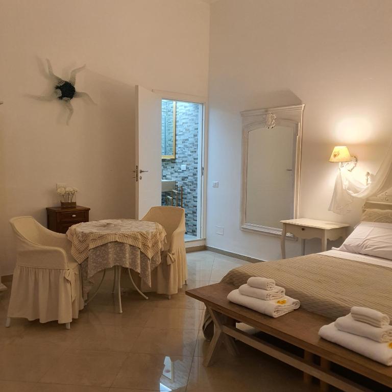 Posteľ alebo postele v izbe v ubytovaní Bianca Suite Polignano