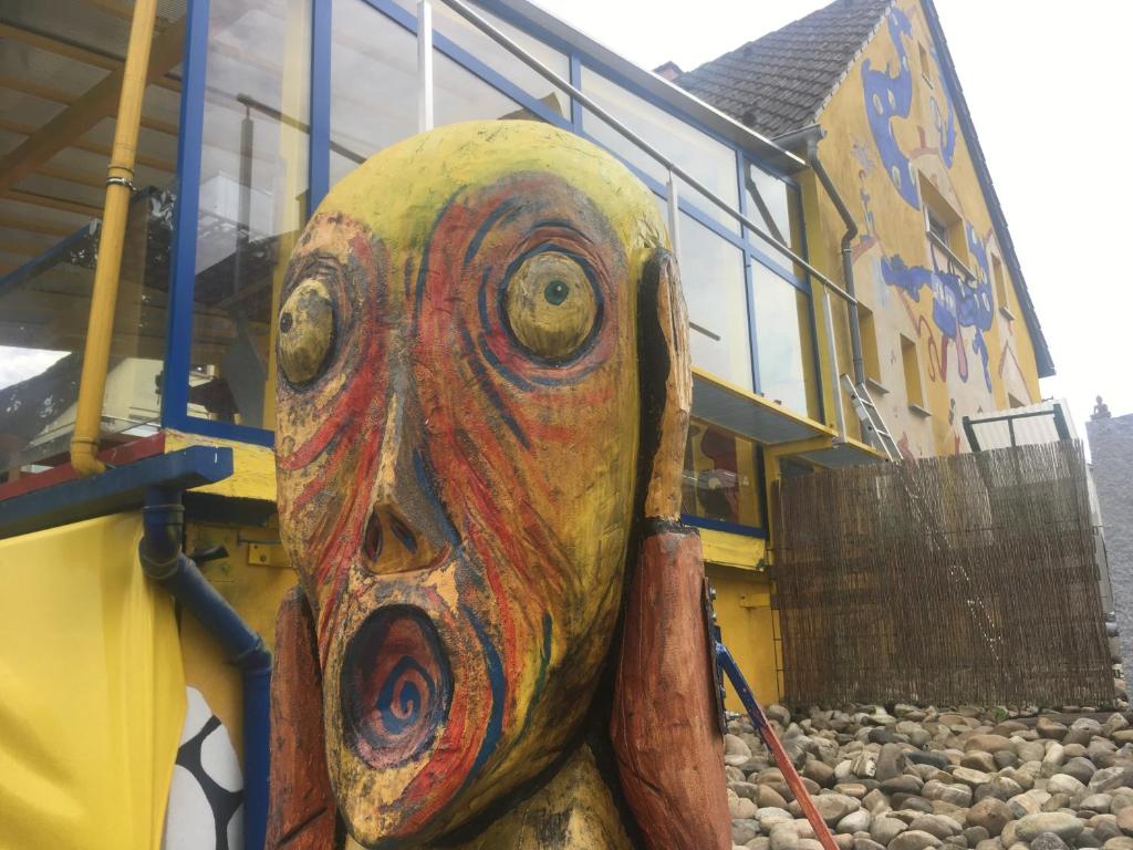 a painting of a face on the side of a bus at Pension Weinsberg in Weinsberg