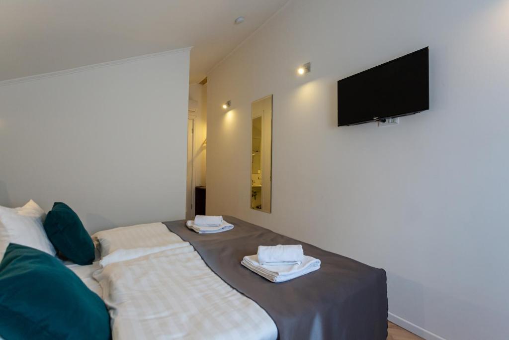 TV a/nebo společenská místnost v ubytování Heritage Hotel Petrakija