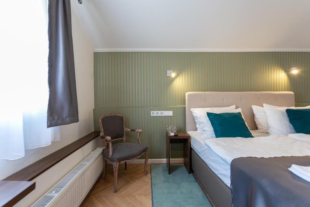 Postel nebo postele na pokoji v ubytování Heritage Hotel Petrakija