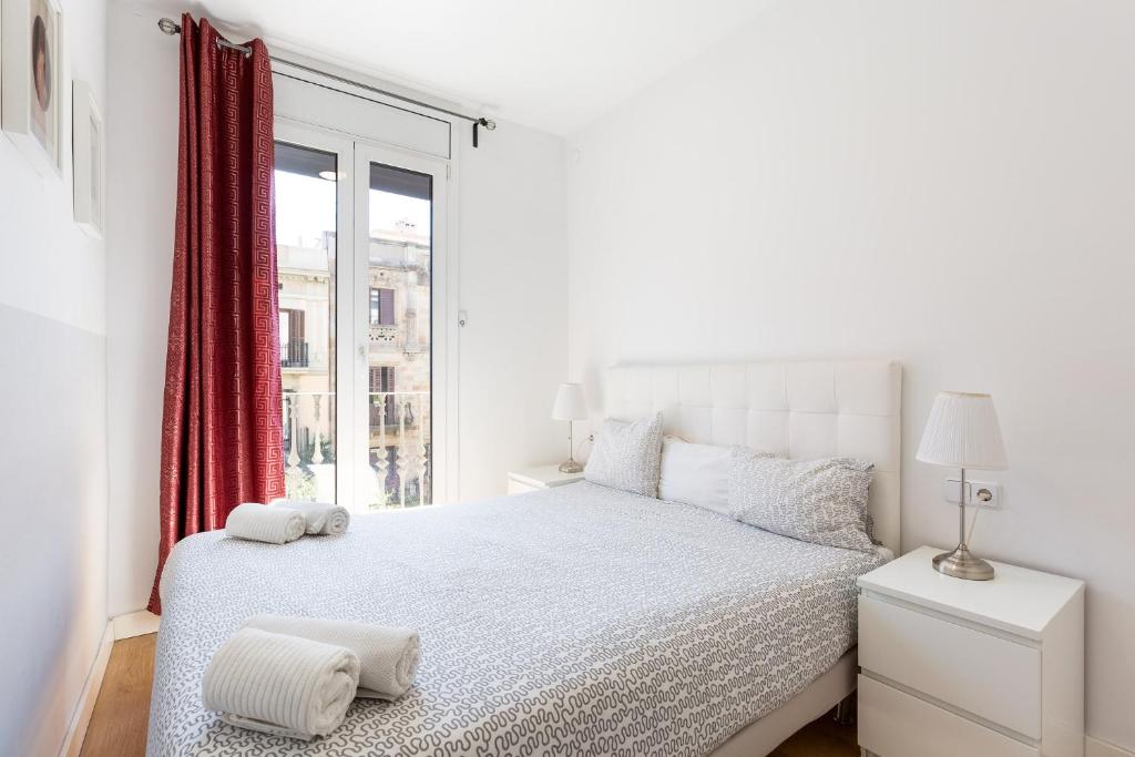 Posteľ alebo postele v izbe v ubytovaní Stay U-nique Apartments Urgell