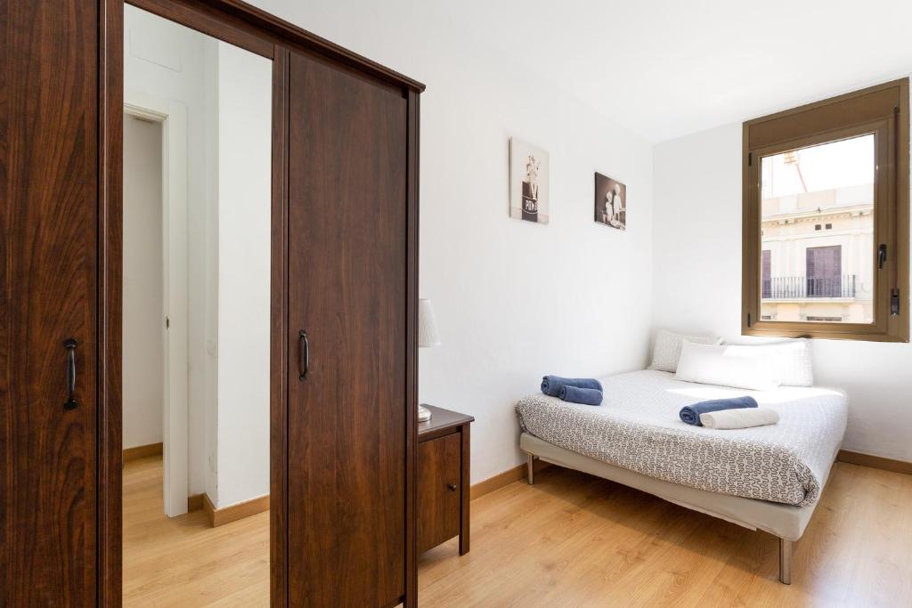 Posteľ alebo postele v izbe v ubytovaní Stay U-nique Apartments Urgell