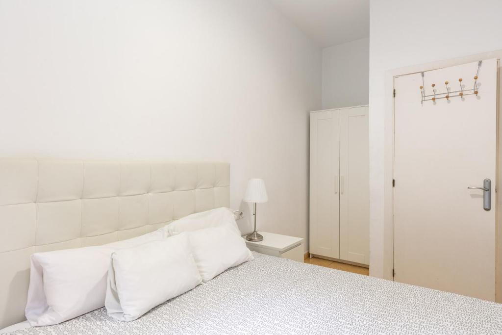 Posteľ alebo postele v izbe v ubytovaní Stay U-nique Apartments Urgell