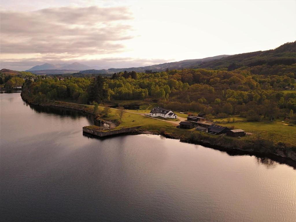 an island in the middle of a body of water at The Apartment at Old Pier House in Fort Augustus
