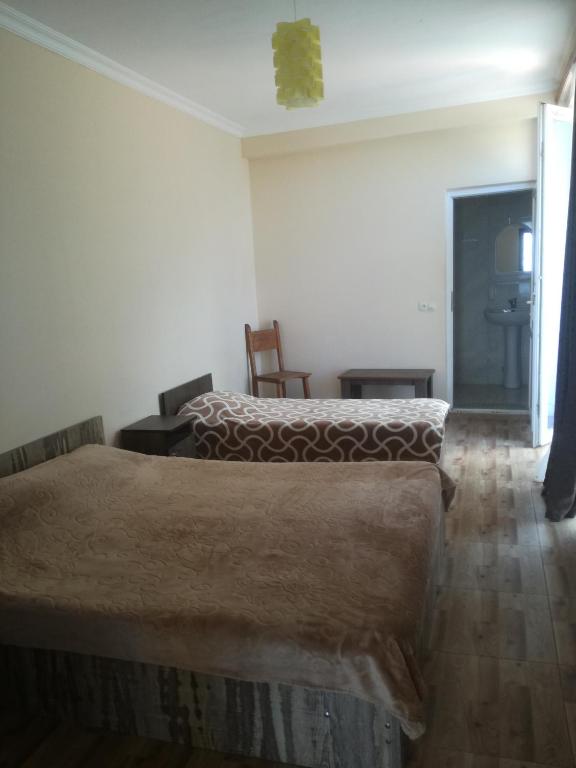 Postel nebo postele na pokoji v ubytování Magnetic Sand Hotel