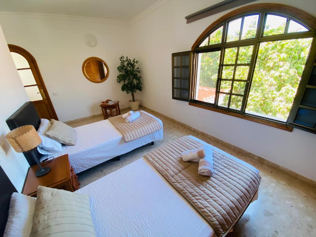 Ένα ή περισσότερα κρεβάτια σε δωμάτιο στο Villa Carolina with private pool