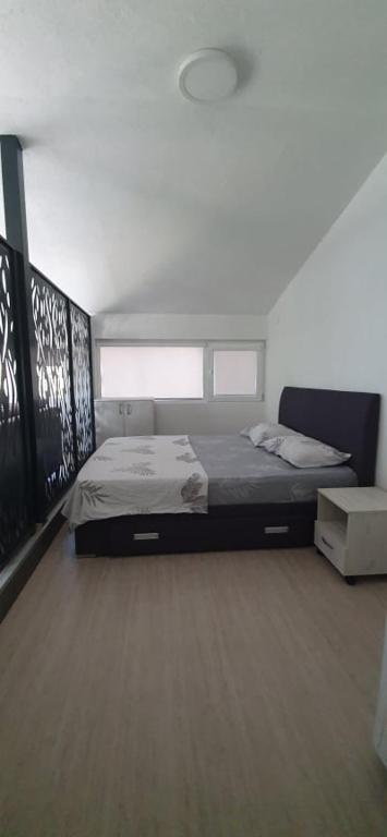 Postel nebo postele na pokoji v ubytování Apartmani Kaldrma